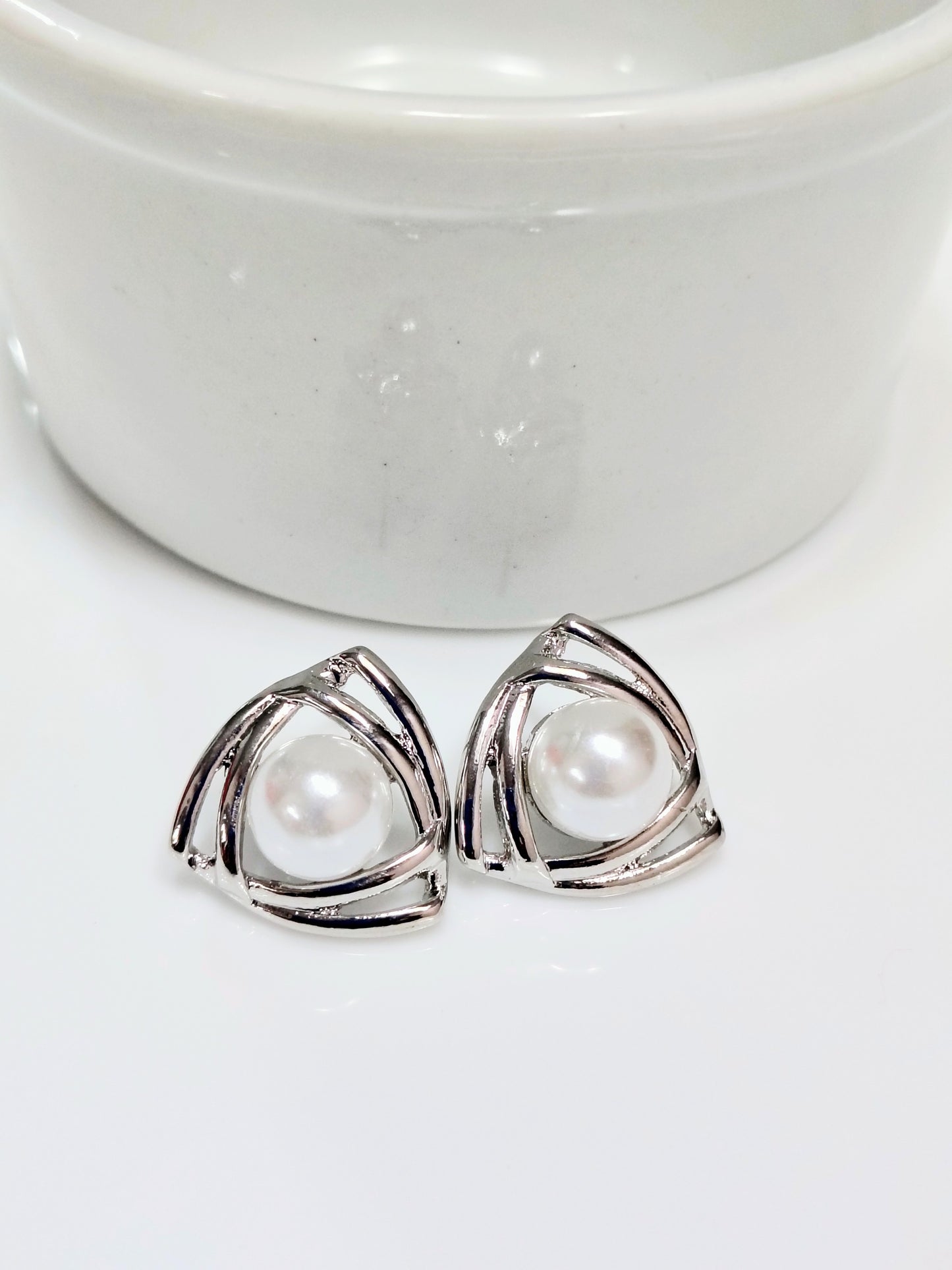 Triângulo com pérola