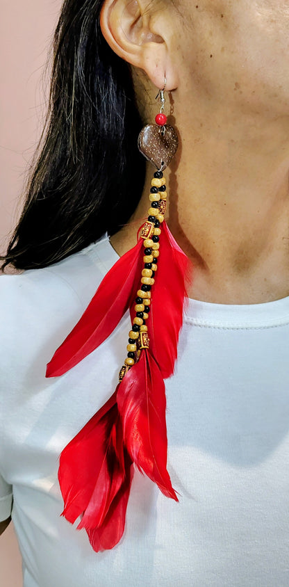 Brinco Penas e sementes Garantido